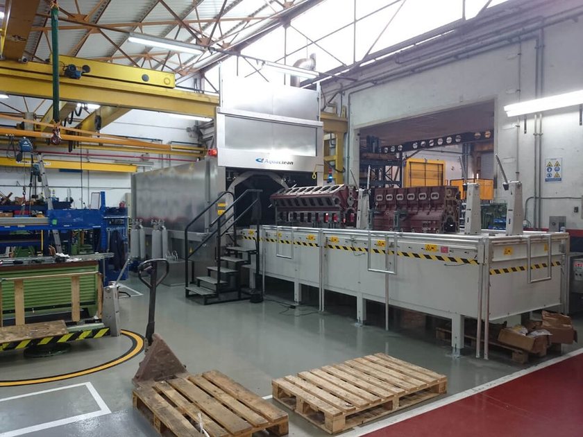 Multi-stage industrial conveyor washing line
